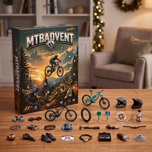 MTBAdvent calendar on a desk with the 24 mini mountain bike trinkets laid out